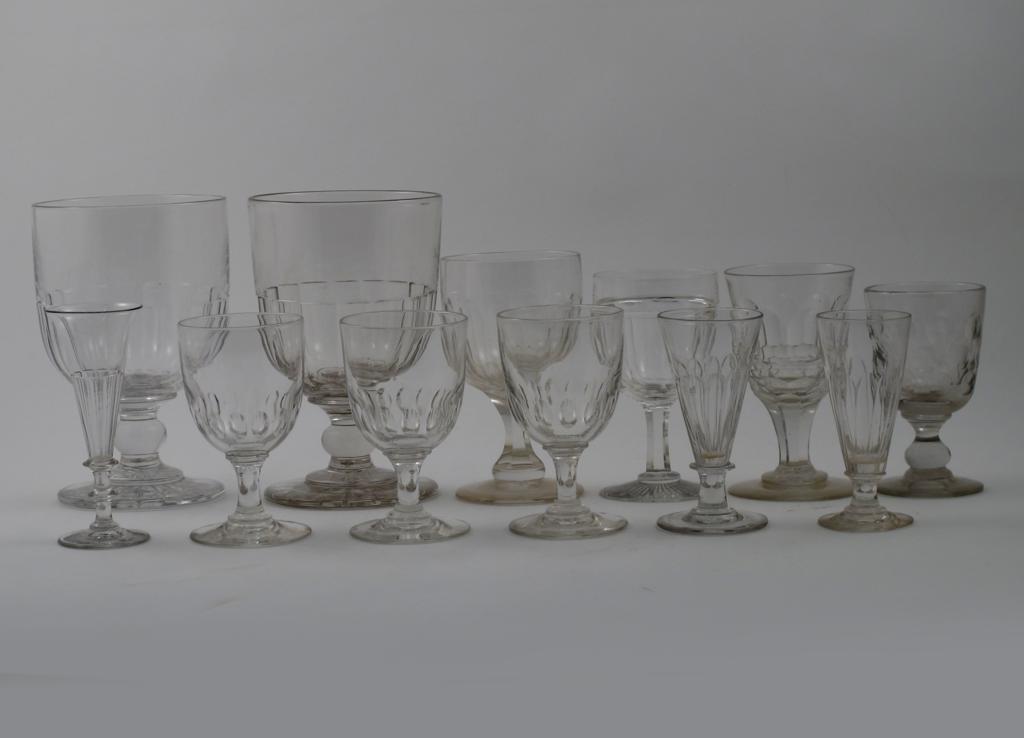 Nine glass rummers most 19th century, variously cut with oval lappets and polished circles, and