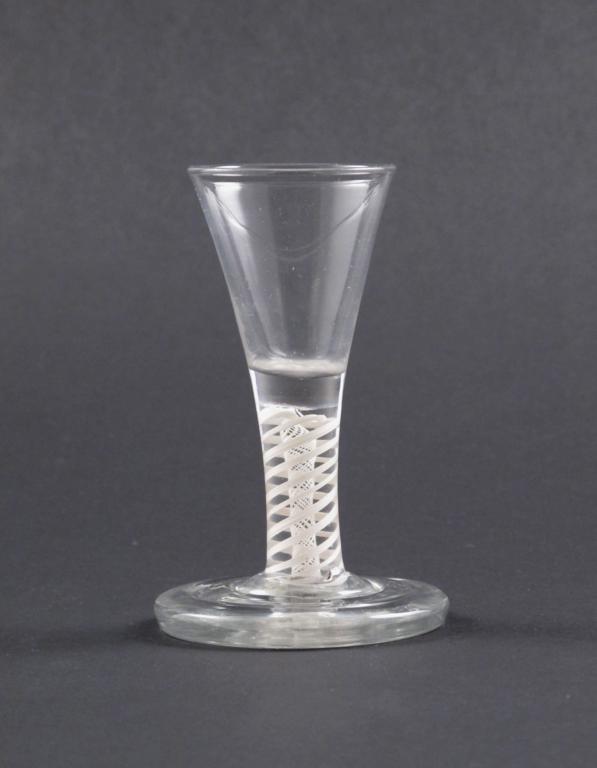 A firing glass c.1770, with trumpet bowl raised on a double series opaque twist stem above a stepped