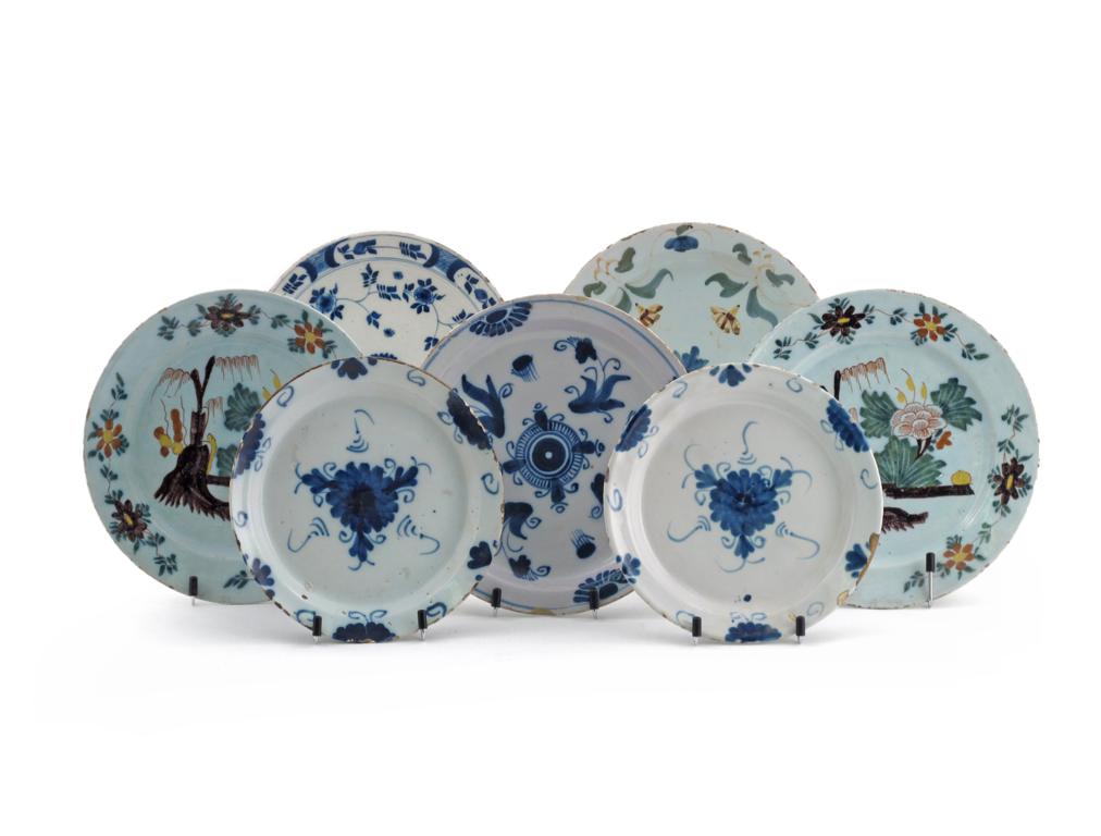 Two pairs of delftware plates 18th century, one pair painted with an Oriental garden scene on
