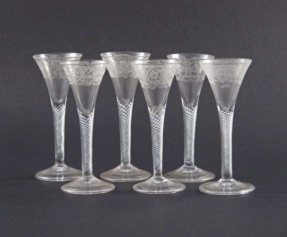 A set of six wine glasses c.1760-70, the drawn trumpet bowls with diamond-point engraving of Maltese