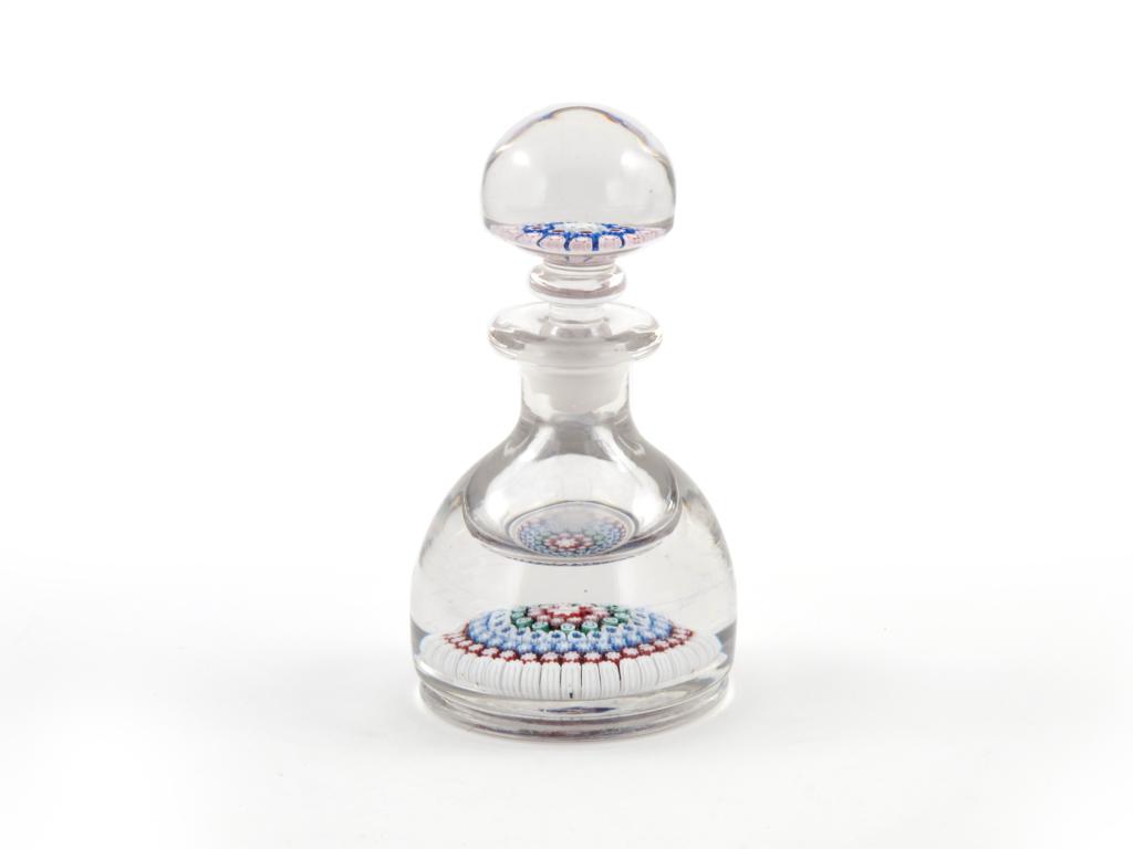 A Whitefriars paperweight ink bottle and stopper 20th century, the base and stopper set with