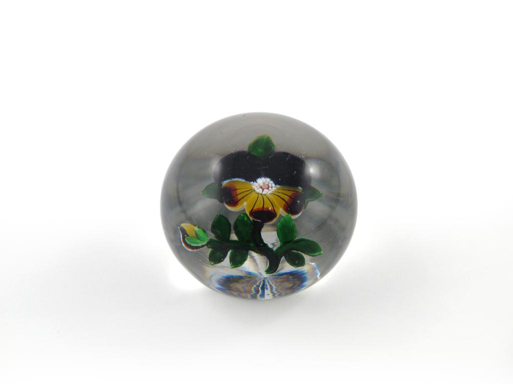 A Baccarat paperweight c.1860-65, inset with a pansy or heartsease, the centre with tiny