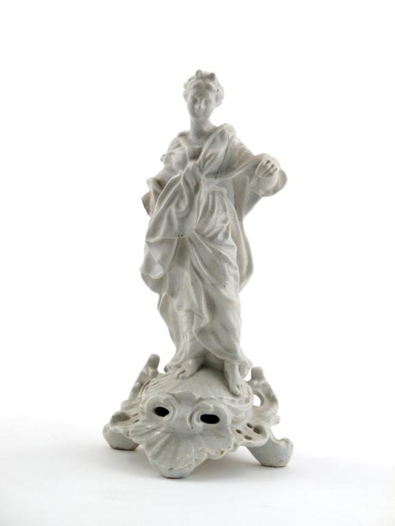 A pottery white-glazed figure of Justice late 18th / early 19th century, after Derby, standing on
