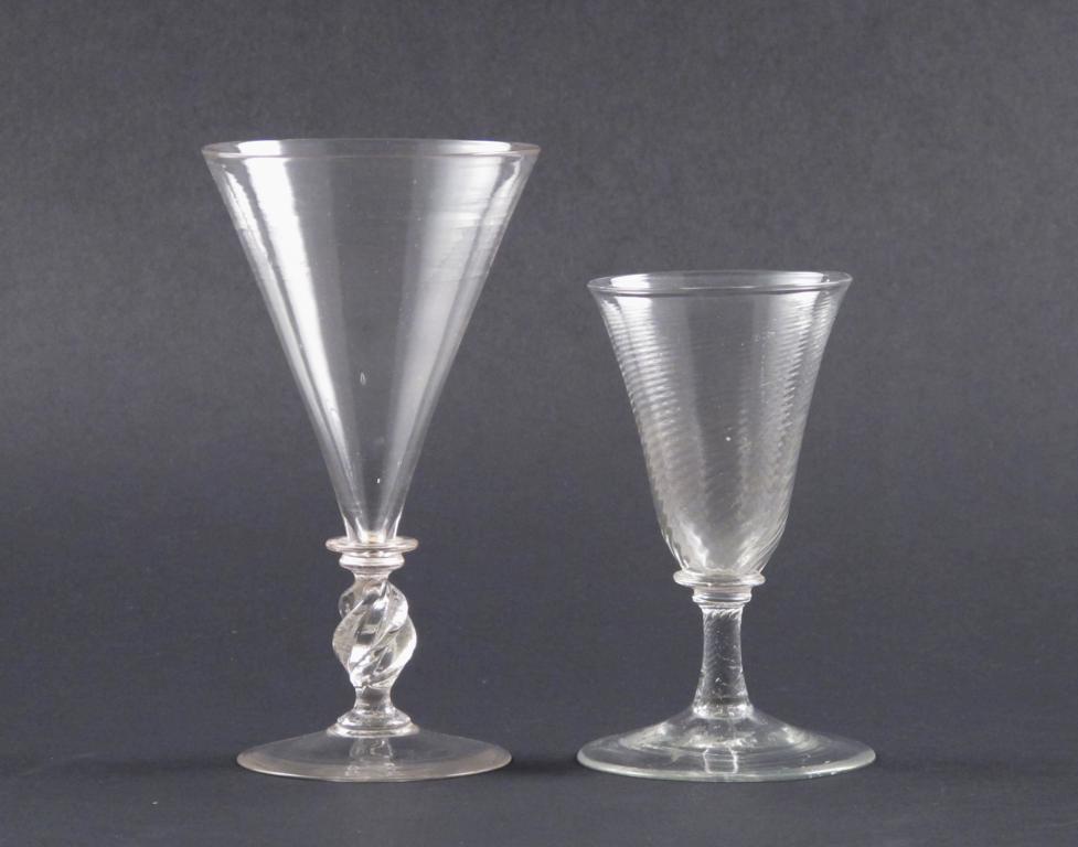 Two façon de Venise glasses 1st half 18th century, the larger with a drawn trumpet bowl above a