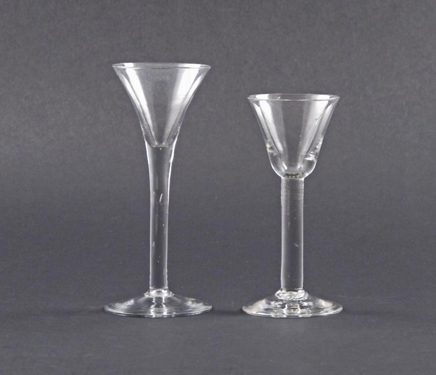 Two wine glasses 18th century, one with a wide flared trumpet bowl, other with a rounded funnel