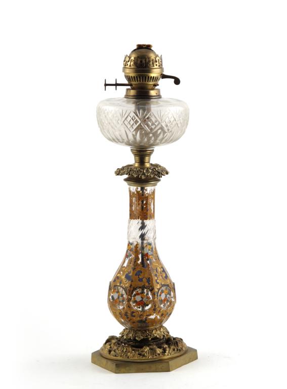 A large Bohemian glass oil lamp 19th century, the lower body baluster-shaped, faceted and