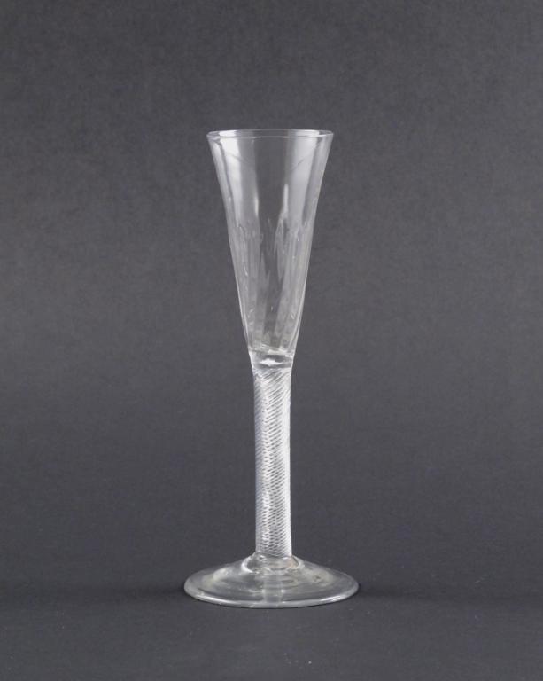 A ratafia wine glass c.1770, the bowl with spiral moulded vertical flutes, raised on an airtwist