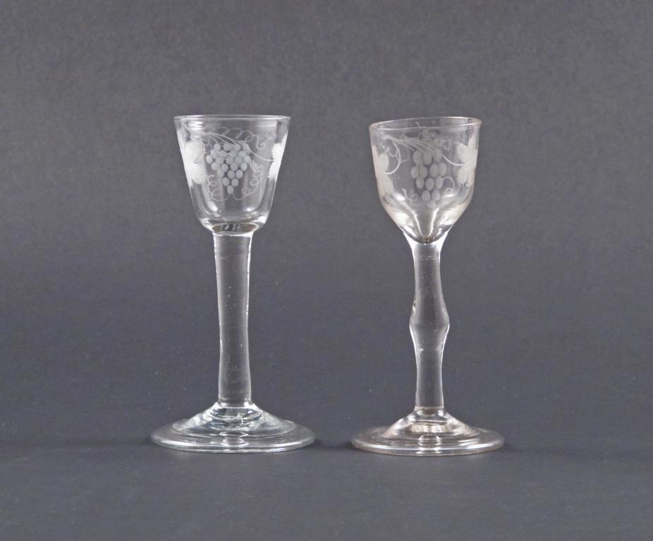 Two small wine glasses mid 18th century, the bowls engraved with birds in flight around fruiting