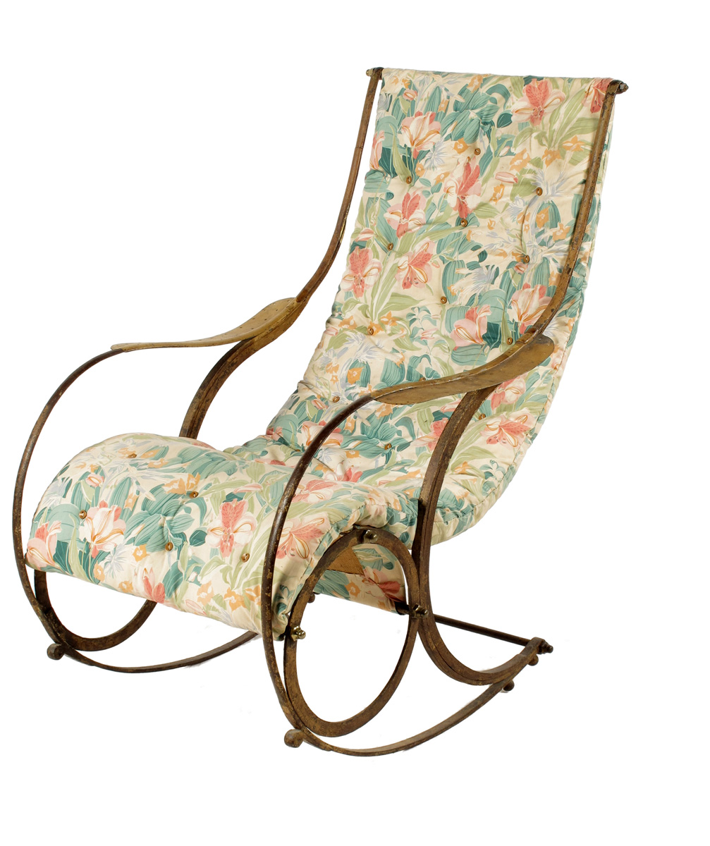 A steel rocking chair after the design by R.W. Winfield & Co., with traces of paint to the frame and