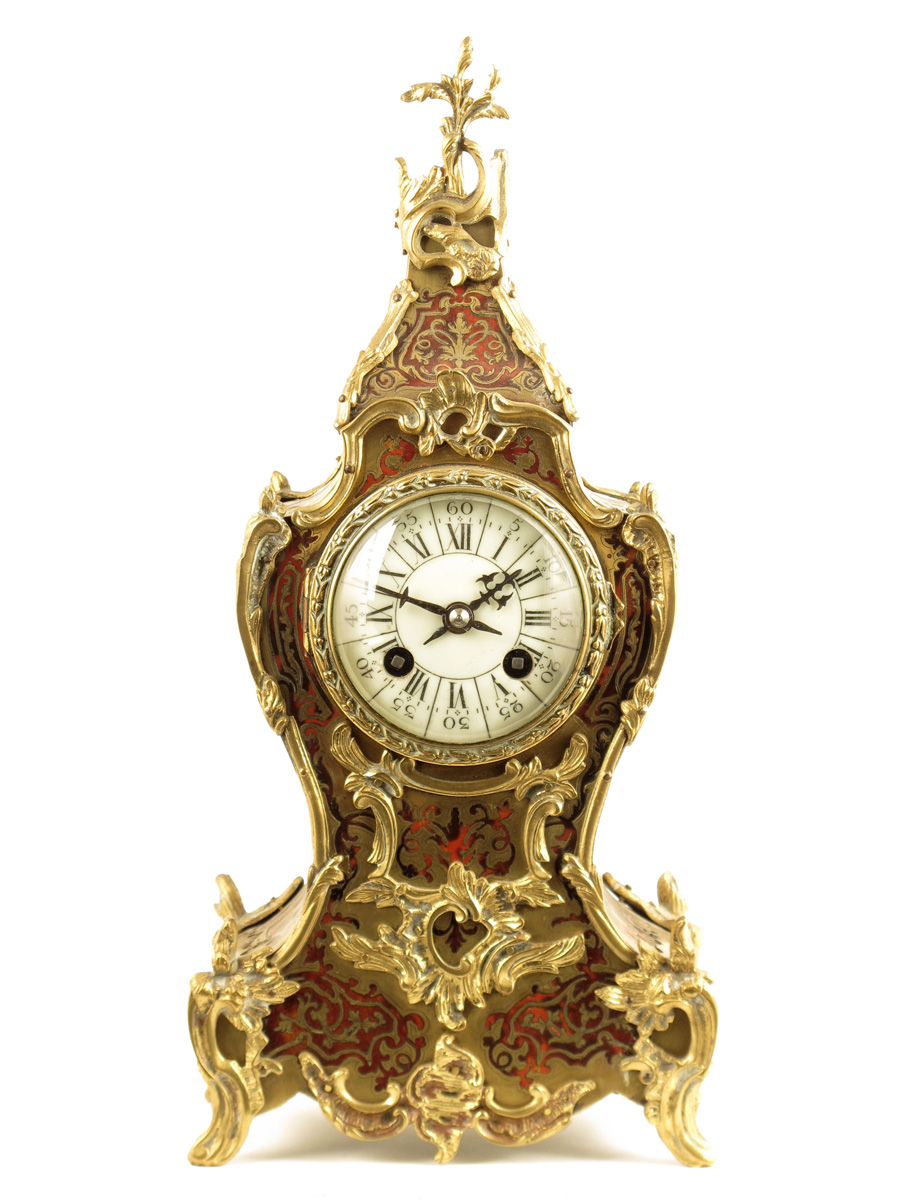 A French boulle mantel clock, cream enamel dial, gong-striking movement by Ad. Mougin, in a