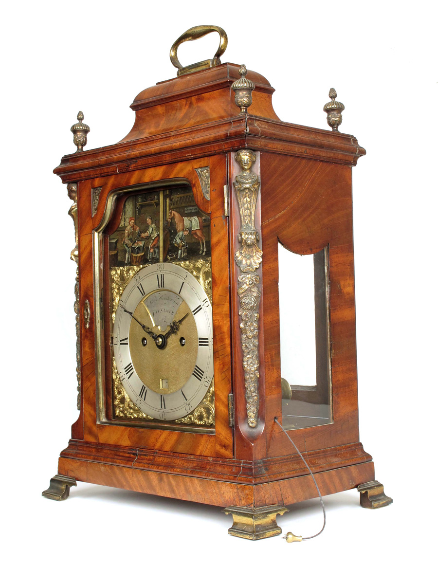 A George III striking mahogany bracket with automaton, the 7 inch brass dial signed on a recessed