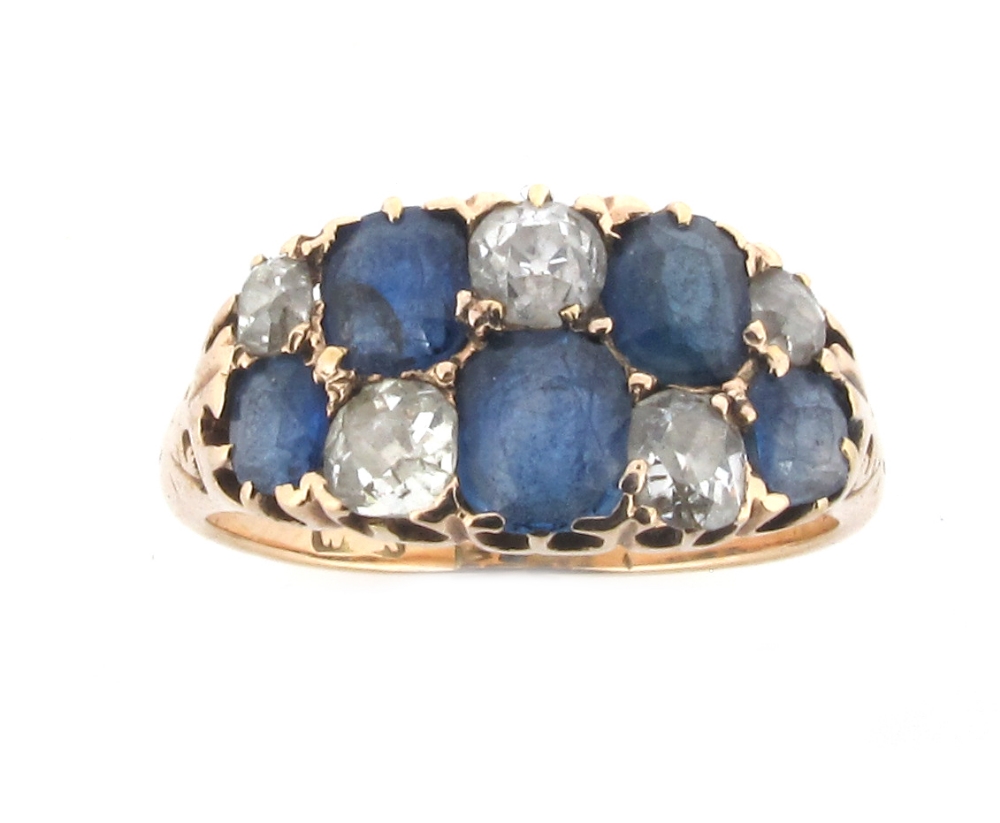 A diamond and sapphire set gold chequerboard ring, size O.