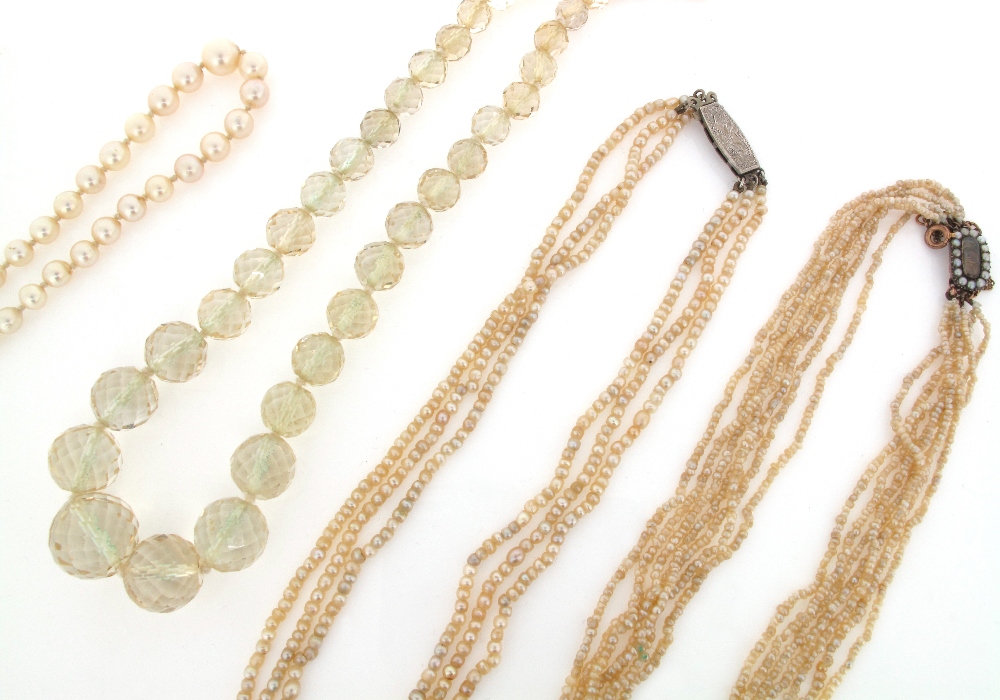 A graduated faceted citrine bead necklace, two seed pearl necklaces and a single row graduated