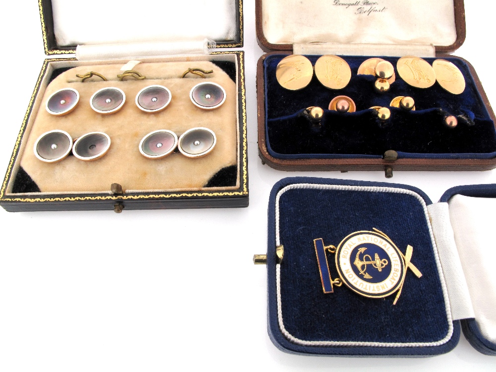 A pair of 18ct gold cufflinks, engraved with crests and initials and seven further gold dress