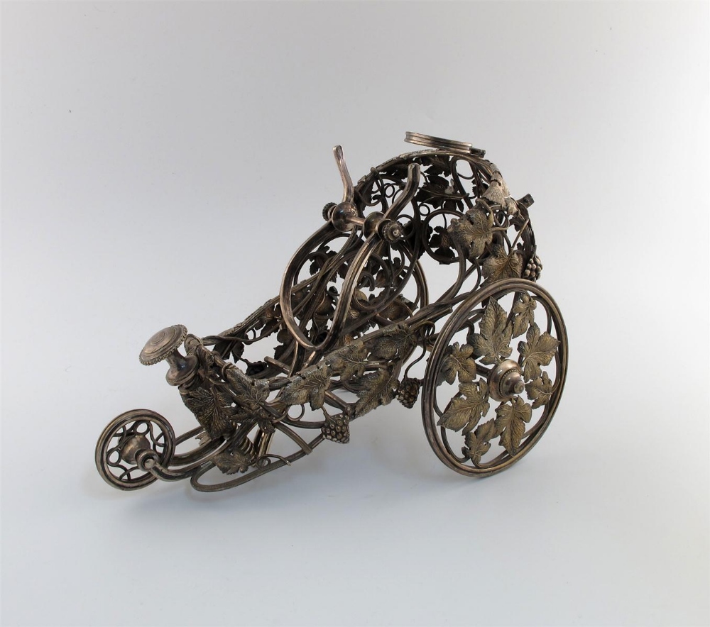 A French electroplated wine carriage, by Christofle, the wirework frame with trailing grapevines,