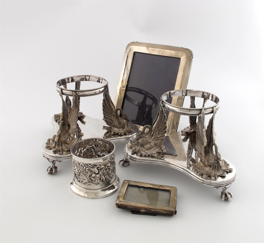 A mixed lot, comprising silver items: a late-Victorian coaster of circular form, embossed foliate