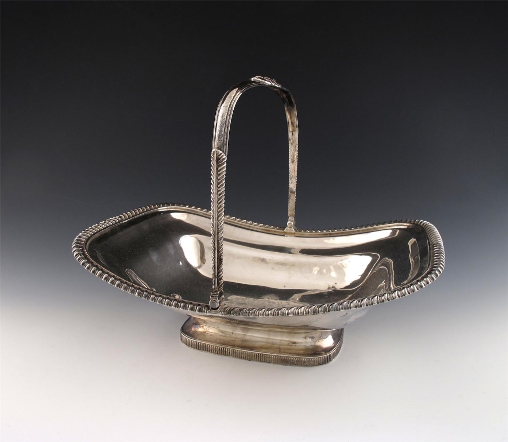 A George III silver swing-handled basket, by Thomas Robins, London 1817, rectangular form, gadroon