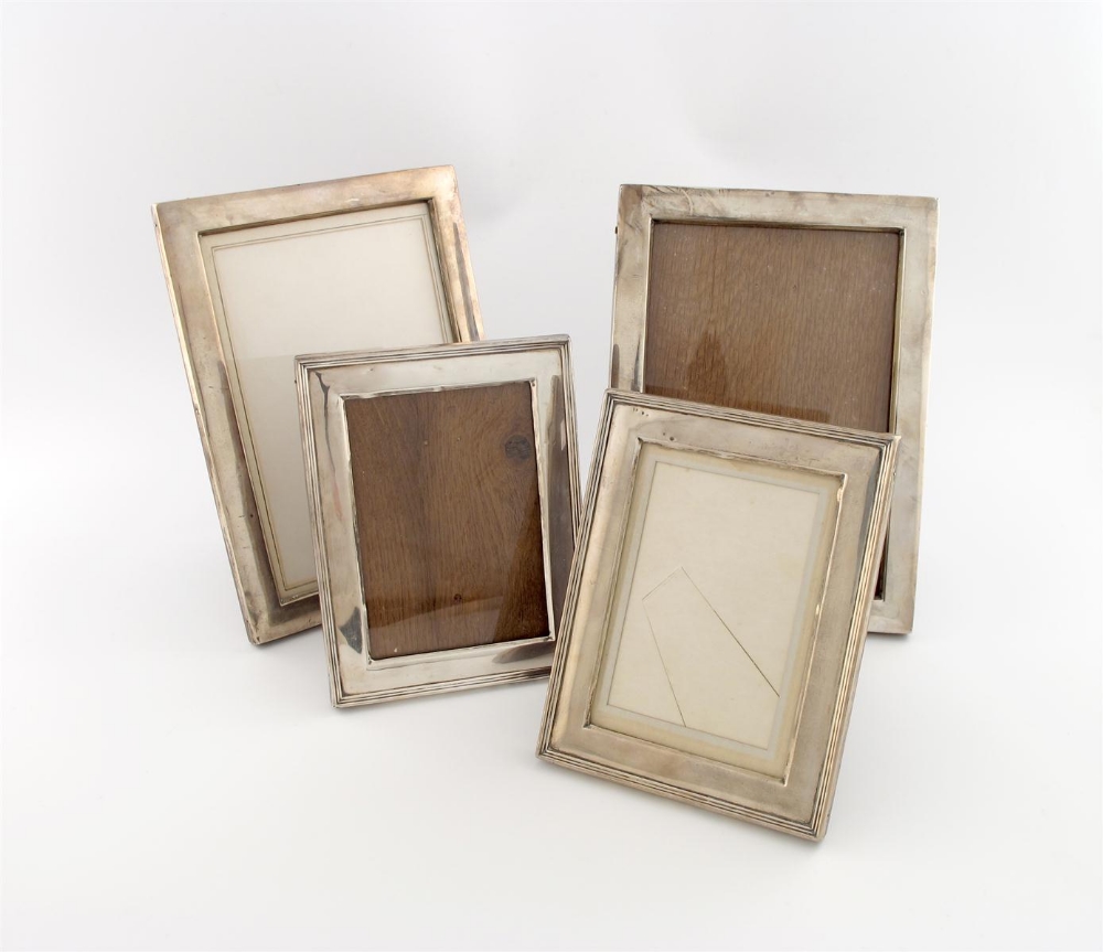 A pair of silver photograph frames, by Charles S. Green and Co., Birmingham 1915, plain upright