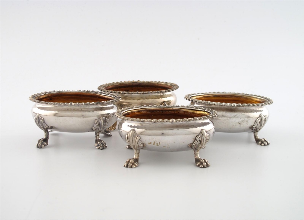 A George III set of four old Sheffield plated salt cellars, unmarked circa 1815, oval bellied form,