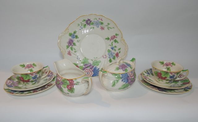 A quantity of Royal Doulton tea wares in the Dunbar design (D5508) comprising a shaped cake plate,
