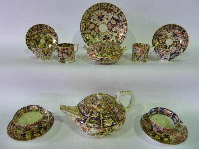 A quantity of 19th century Derby Imari pattern wares comprising teapot and cover of circular form,