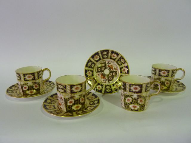 A set of four Crown Derby coffee cans and saucers in the "Imari" pattern number 2451