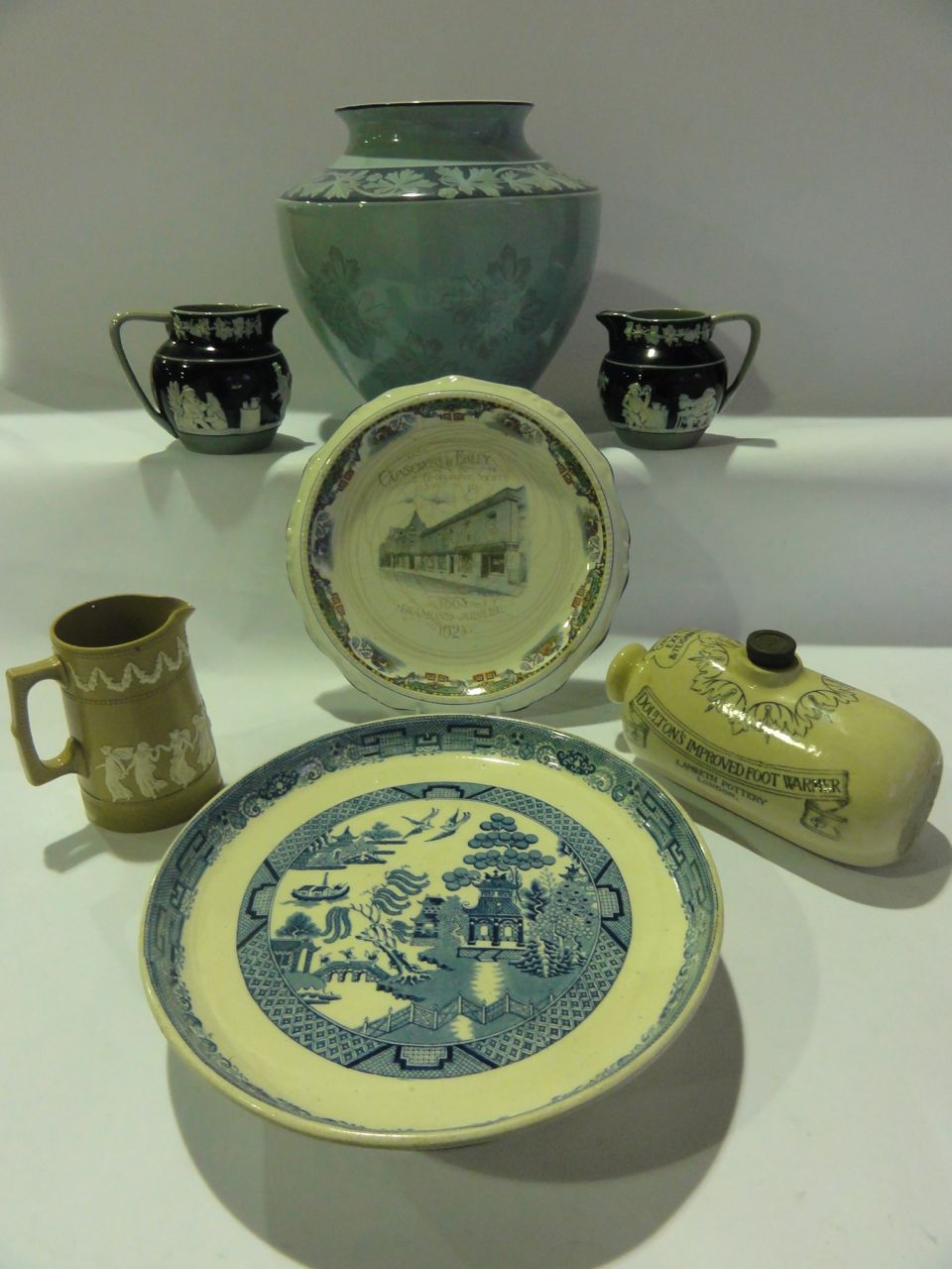 A large blue Wedgwood earthenware jardini¦re with floral decoration, three Copeland Spode sprigged