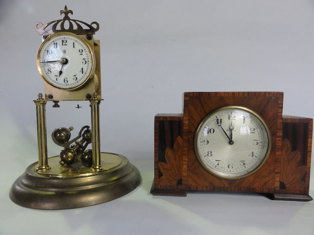 An Art Deco mantle clock in walnut with 8 day movement together with a brass anniversary clock
