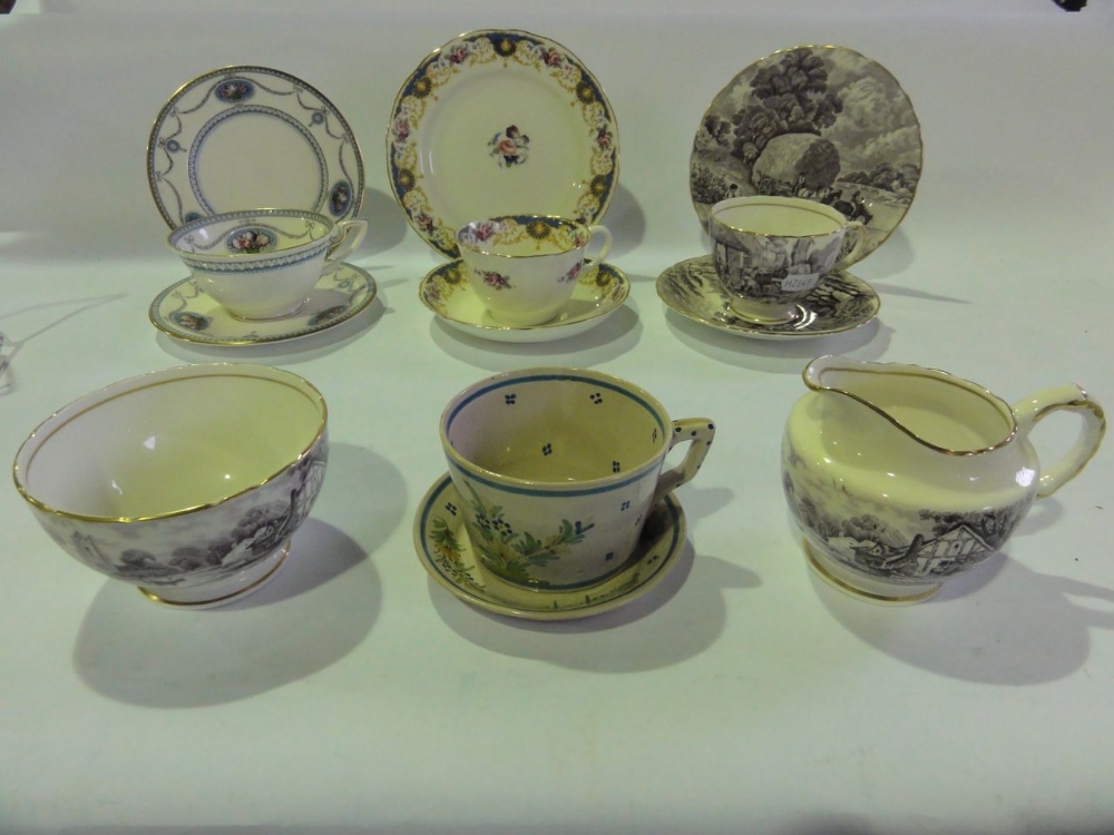 A quantity of Sevres tea wares comprising seven trios, two bread plates, two continental Quimper tea