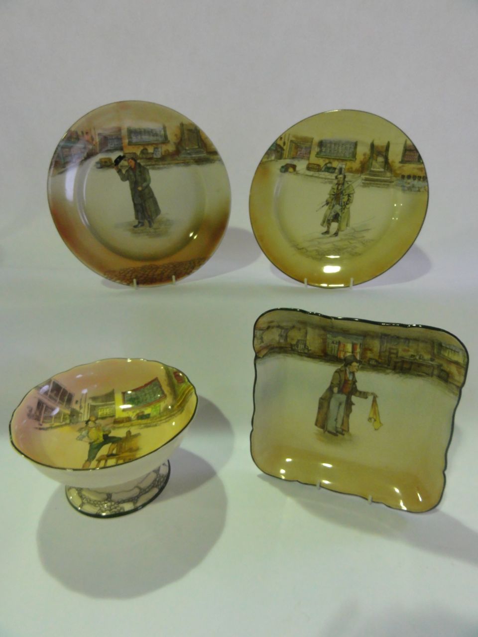 A selection of Royal Doulton Dickens ware including a Sam Weller bowl on a pedestal foot D6327, an