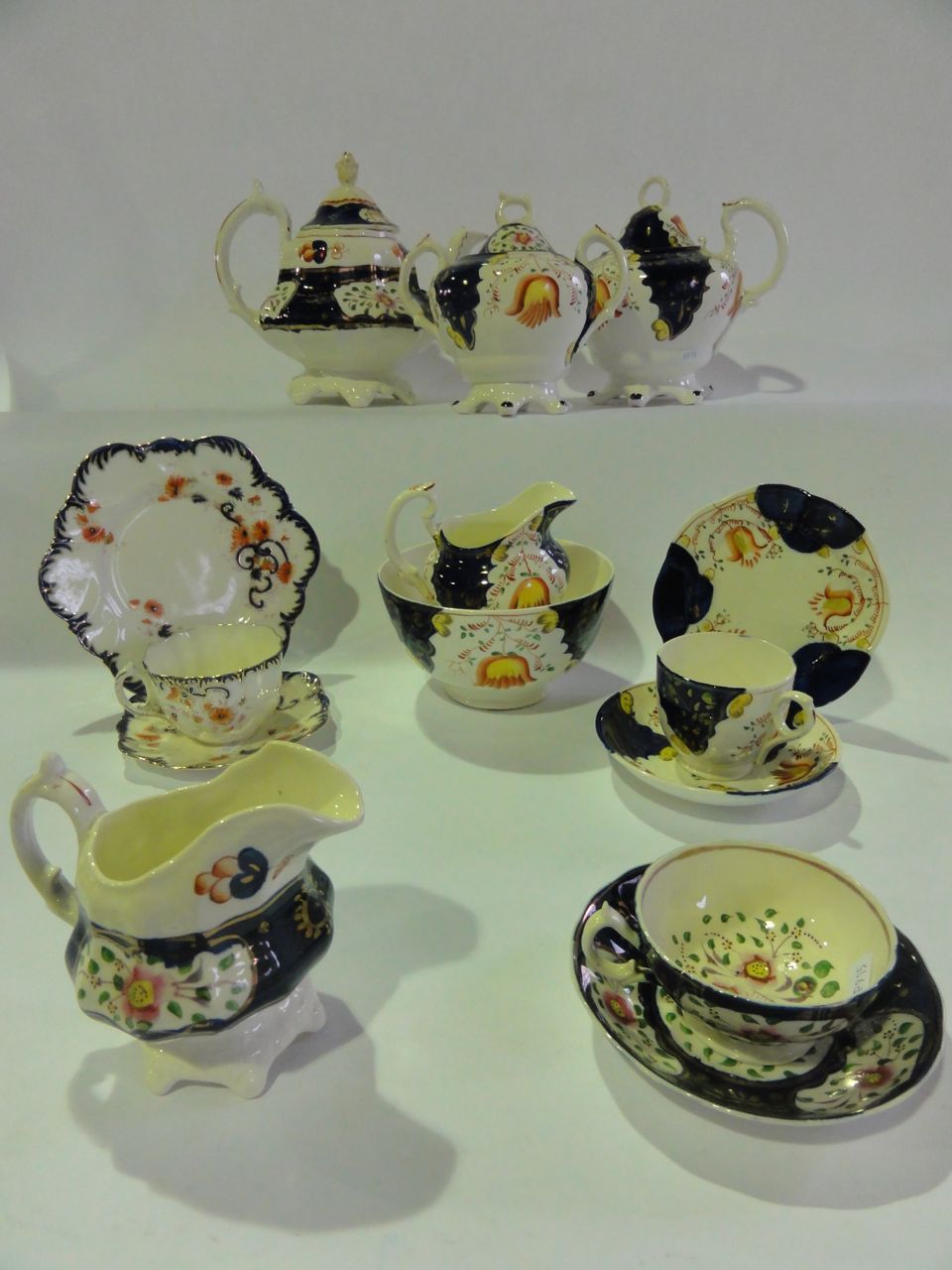 A large quantity of gaudy Welsh tea wares comprising two teapots, lidded sucrier, two milk jugs,