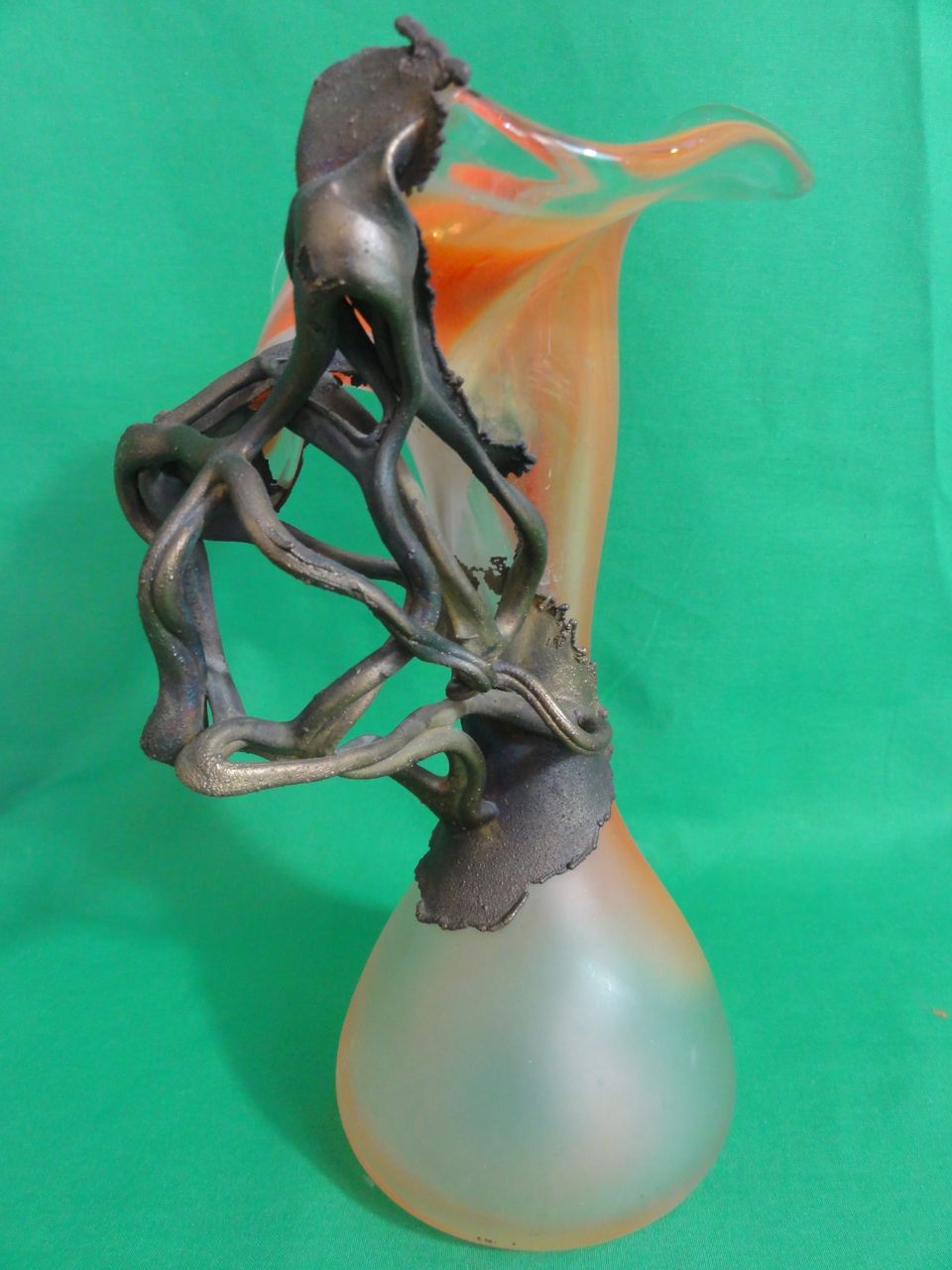 An orange and frosted vase of flared form with applied gilded tangled decoration, indistinct