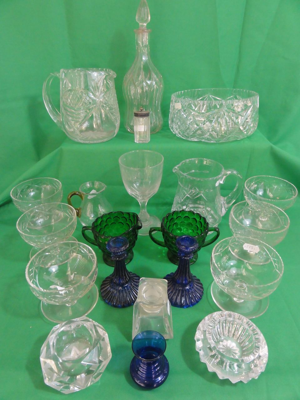 A selection of crystal and other glass including a cut salad bowl, two water jugs, decanter, green