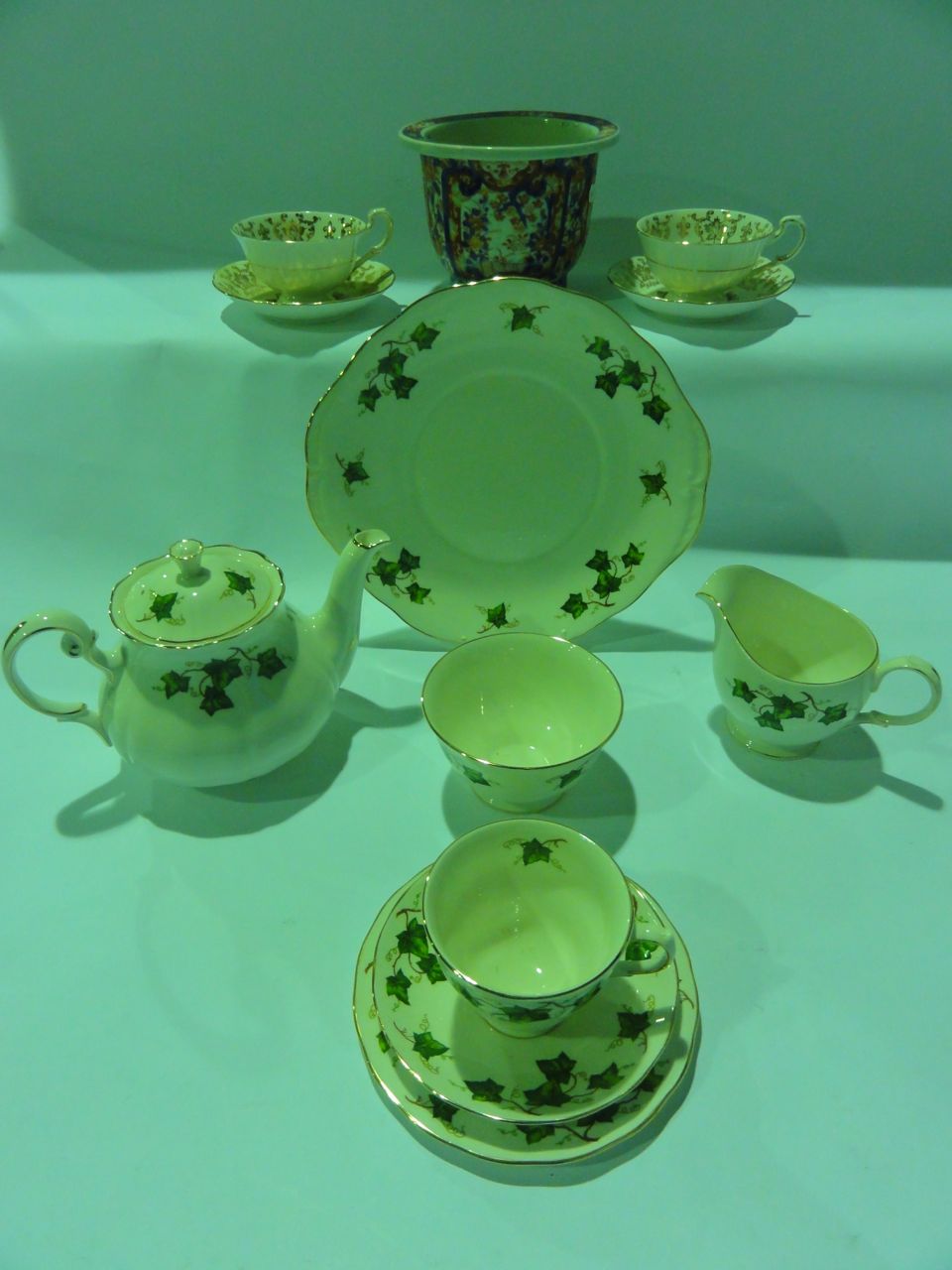 A Ridgway`s Pottery Colclough tea set comprising teapot, bread plate, sugar bowl, milk jug, six