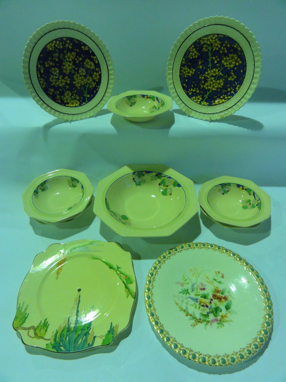 Six Royal Doulton "Wynn" pattern bowls (two sizes) and a serving bowl, a 19th century plate with