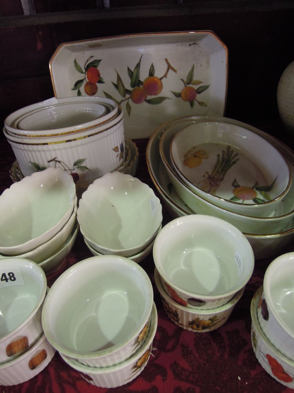 A large quantity of Royal Worcester "Evesham" table wares comprising twelve ramekin dishes, two flan
