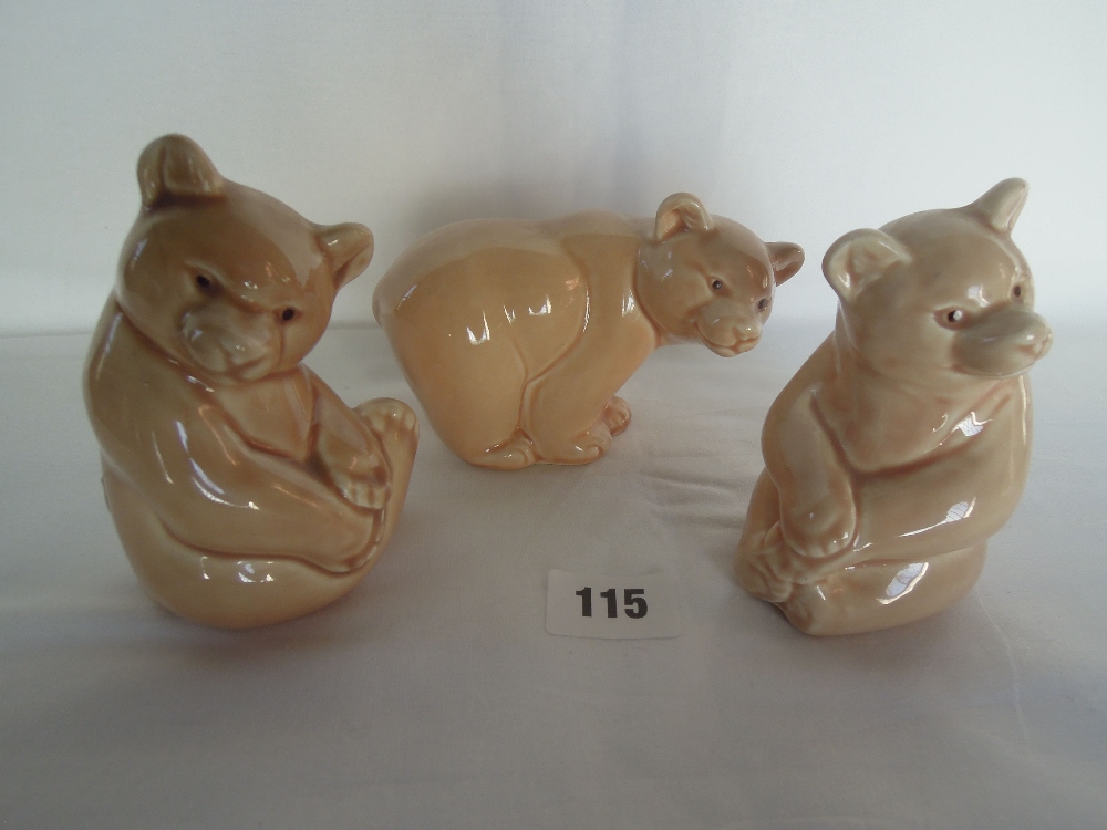 A set of three Poole Pottery bears in pale brown glaze, all 10cm high approx