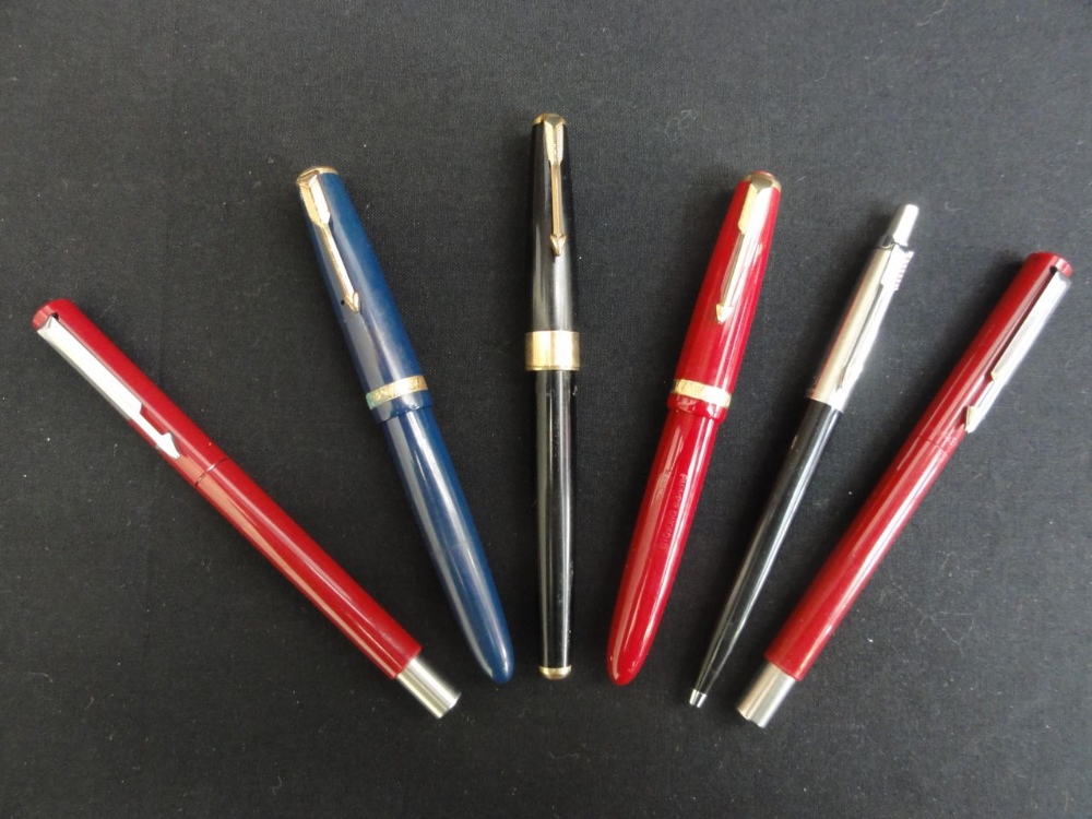 Three parker vintage pens in blue, black and red colourway with three other Parker pens