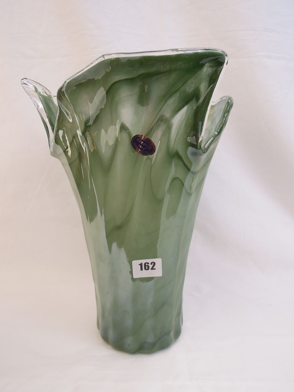 A contemporary vase in green labelled Alvorazione Arte Murano with shaped top, 33cm high approx