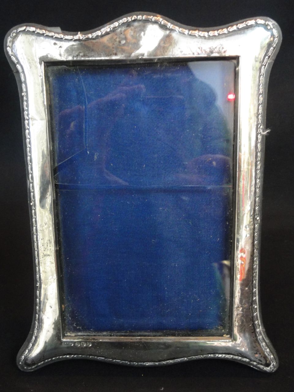 A silver mounted glass photograph frame, hallmarked G & C Ltd, Birmingham, 1912, 12 x 18cm approx