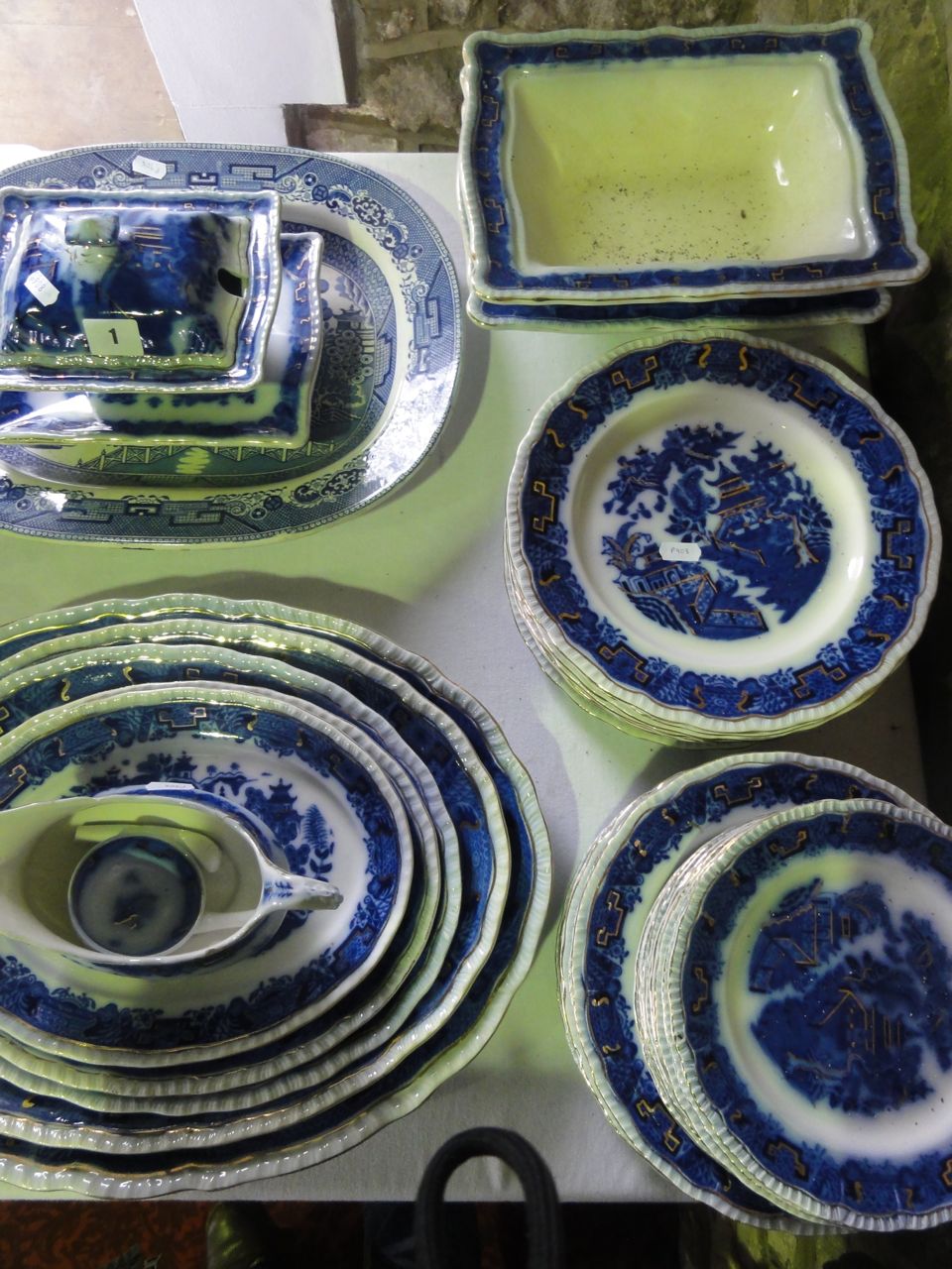 A quantity of Flow Blue Bristol Mandarin pattern dinner wares comprising a graduated set of five