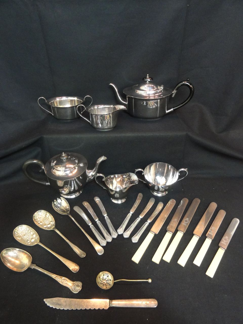 Two three piece silver plated EPNS tea sets together with a quantity of plated flatware, and