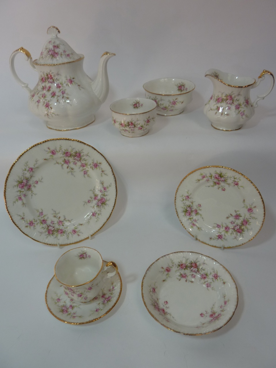 A quantity of Paragon "Victoriana Rose" tea wares including teapot, milk jug, two sugar bowls, six