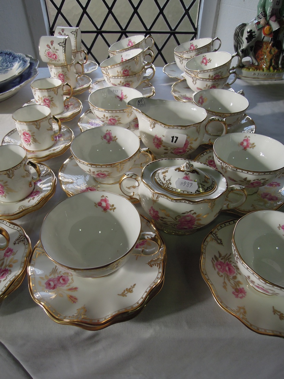 A quantity of Royal Crown Derby "Pinxston Roses" tea and coffee wares comprising fourteen tea