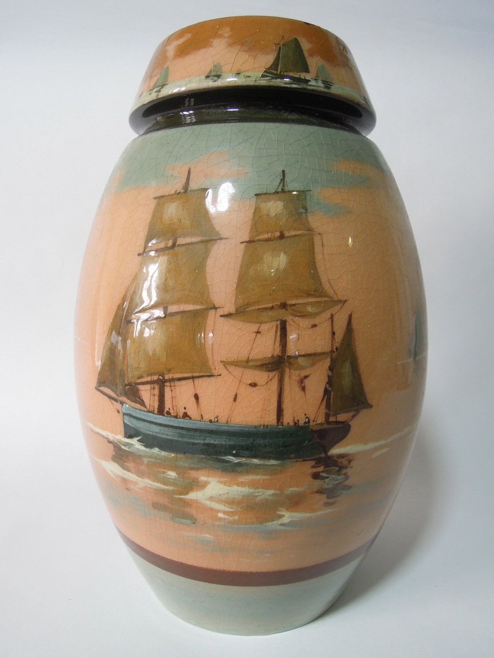 A Royal Doulton oviform vase decorated with a sailing ship on a peach ground, 29cm high approx