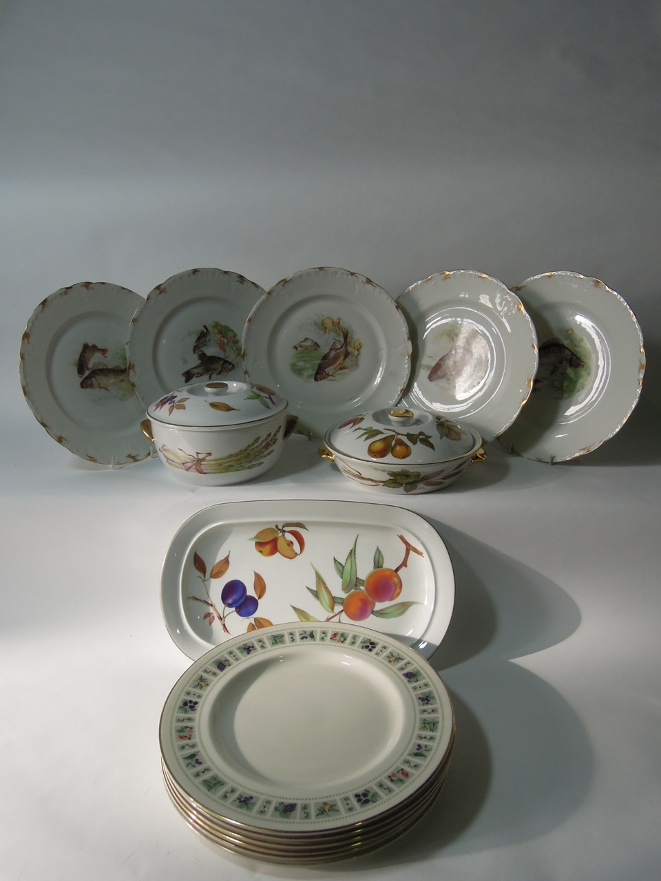 A quantity of Royal Worcester "Evesham" pattern dinner ware including two lidded tureens, a