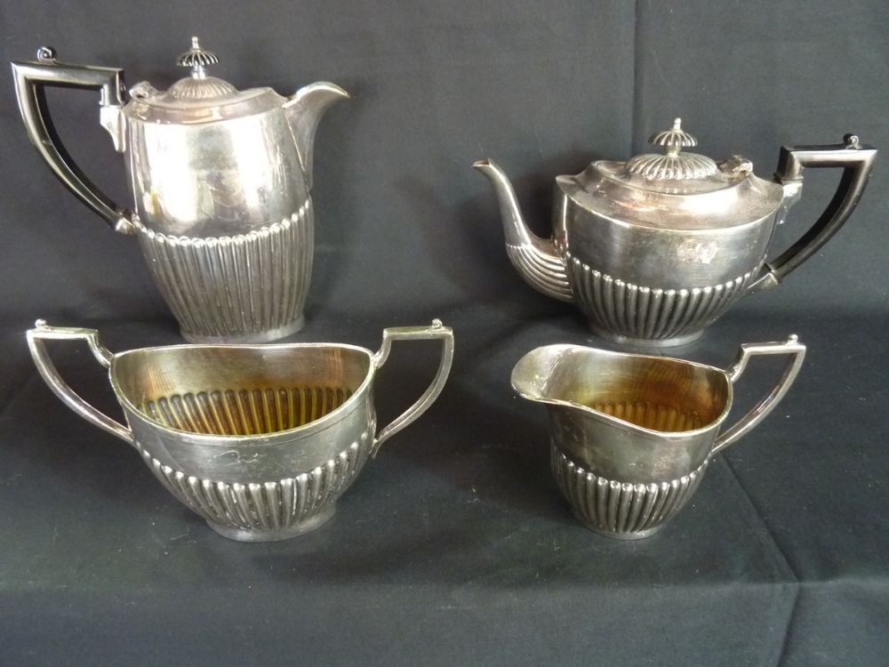 A four piece EPBM tea set including teapot, hot water jug, two handled sugar bowl and milk jug
