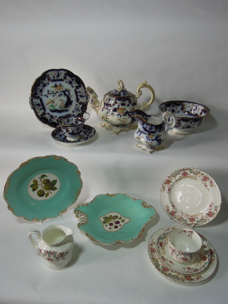 A mid-Victorian blue and white part tea set with oriental style decoration including teapot, milk