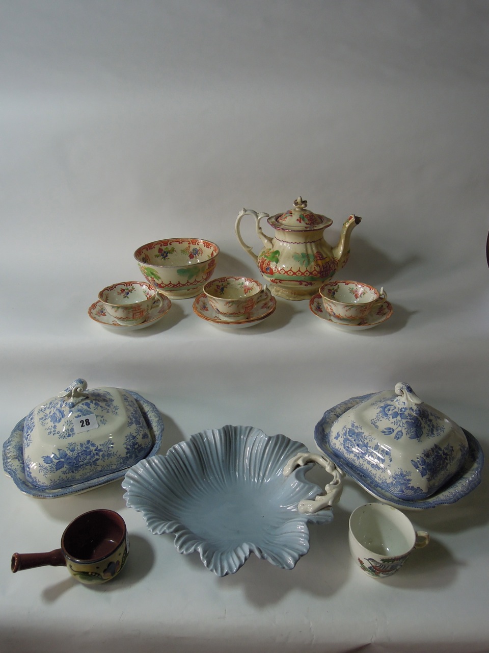 Two 19th century transfer printed blue and white "Asiatic Pheasant" lidded tureens with scrolled