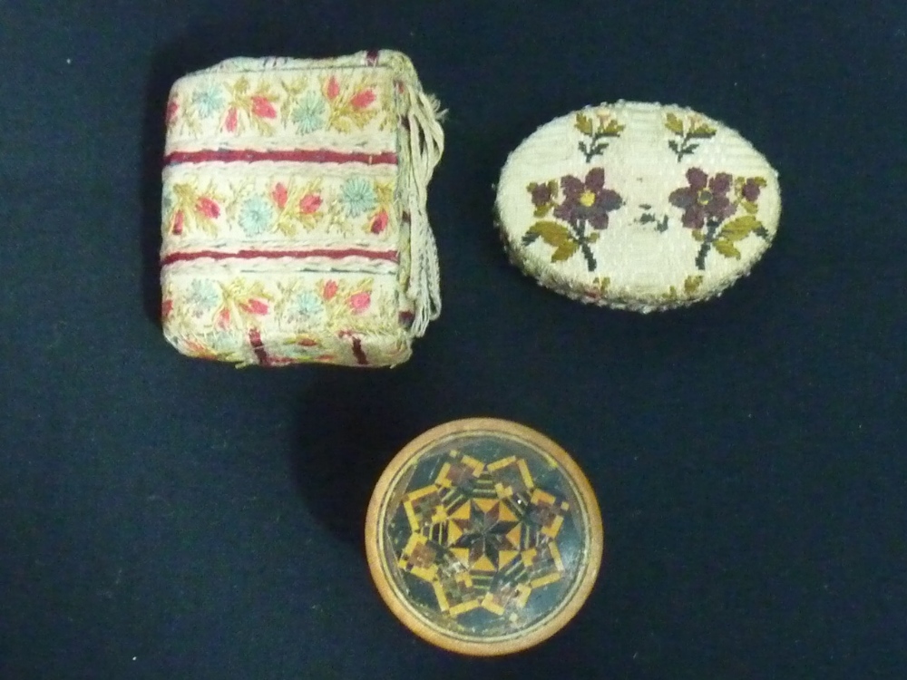 A graduated nest of seven Tunbridgeware cylindrical boxes (by T Barton Late Nye) and two needles